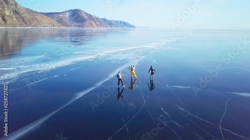Tourists on the ice from aerial view. Winter in Siberia, Baikal Lake.