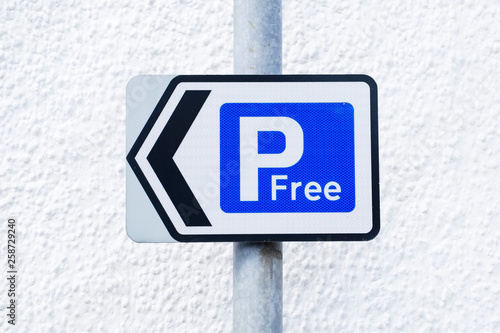 Free parking sign no fee payment or ticket required
