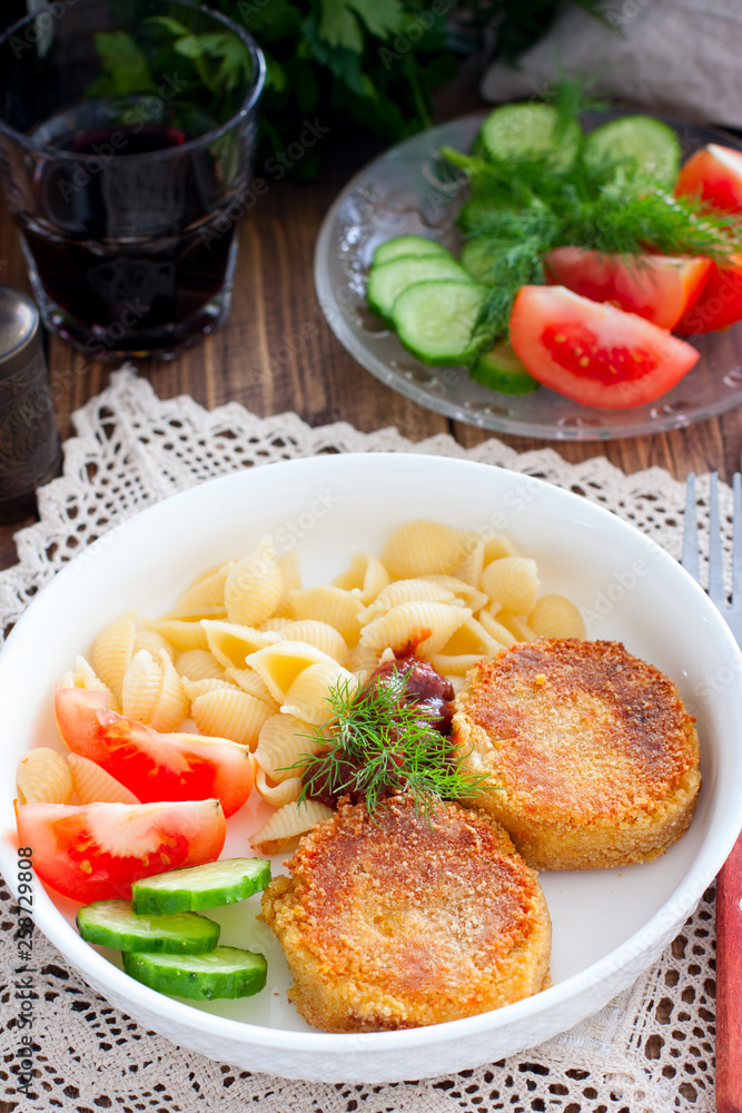 Chickpea cutlets with vegetables and pasta, selective focus Chickpea cutlets with vegetables and pasta, selective focus