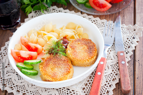 Chickpea cutlets with vegetables and pasta, selective focus
