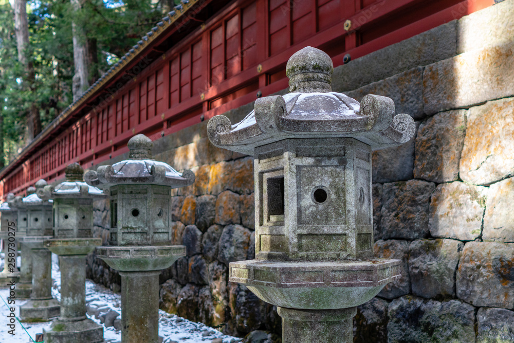 Stone Lantern Pillars of Nikko Futarasan Jinja in Winter Shinto Shrine in Tochigi, Japan