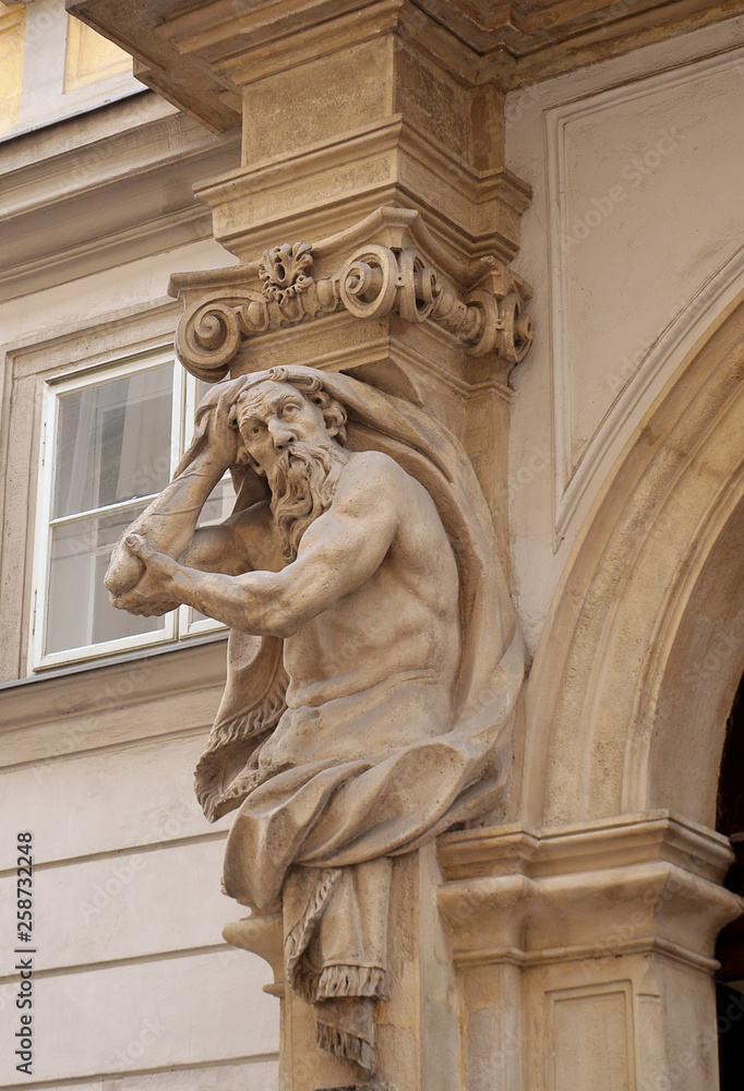 Detail from an Atlas or Atlante, a male figure used for support in a building, on a doorway in Vienna's old town
