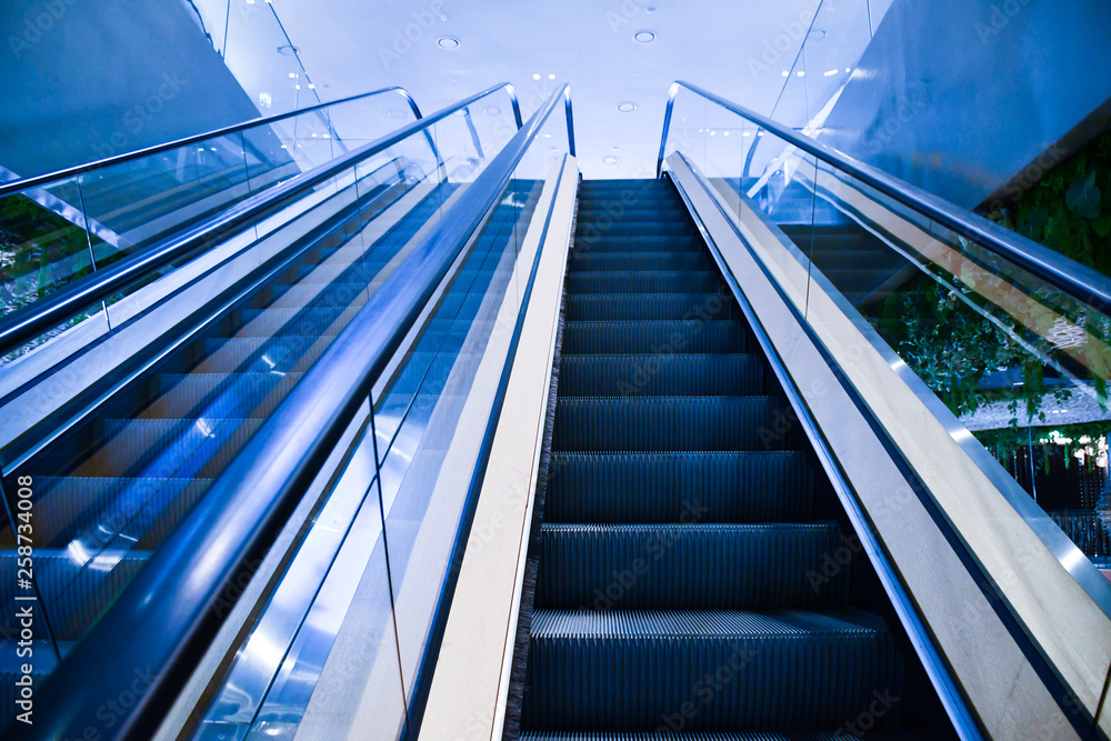 way to top, Escalators in modern shopping mall and office building. way to top, Escalators in modern shopping mall and office building.