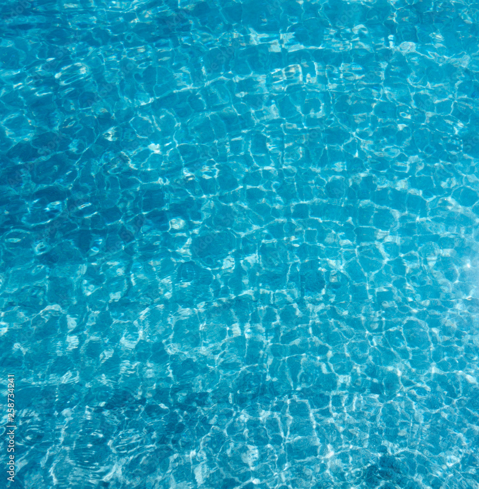Blue water and small wave in the pool as for summer background. Blue water and small wave in the pool as for summer background.