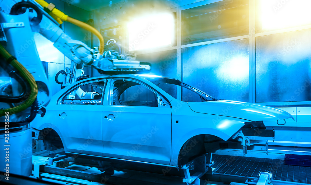 Naklejka premium In the automobile manufacturing and manufacturing plant, the car frame is being painted.