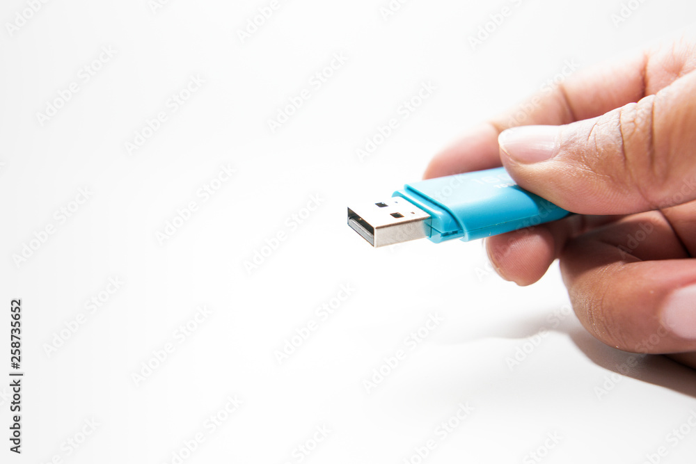 Digital data memory concept.Hand holding pendrive on white background Digital data memory concept.Hand holding pendrive on white background