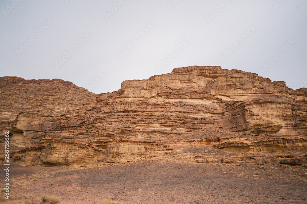 Beautiful landscape consisting of rocky mountains in the middle of the Wadi Rum desert in Jordan.