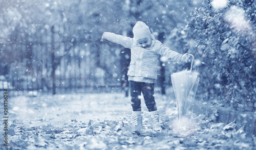 Kids walk in the park first snow Kids walk in the park first snow