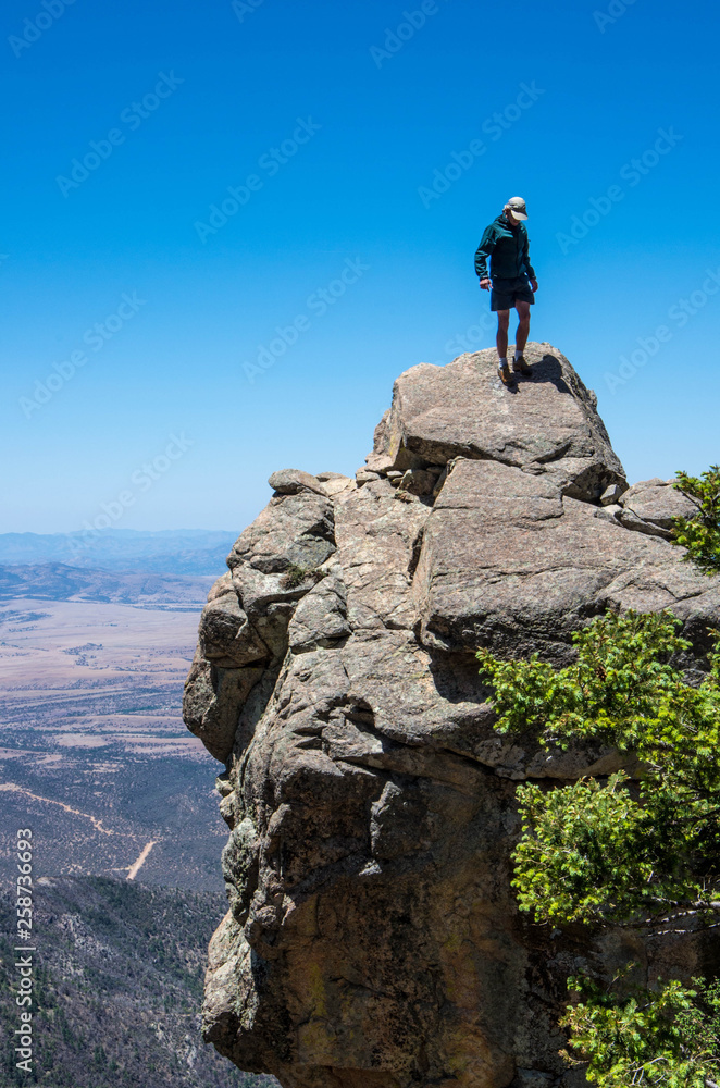 Sierra Vista/USA - 18 May 2013: Hiker on a rock