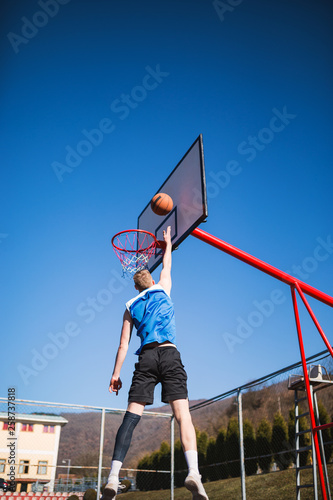 Basketball player slam dunk