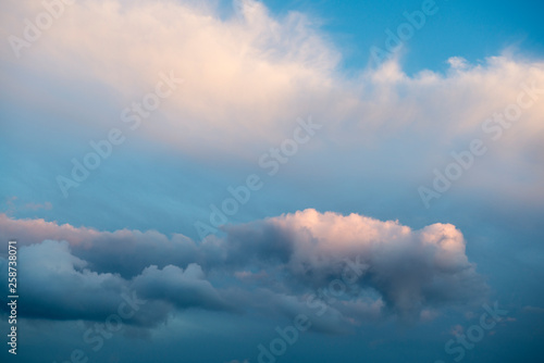Beautiful colorful sky with clouds, view of the orange, blue, red and white sky, nature scenery, sunset