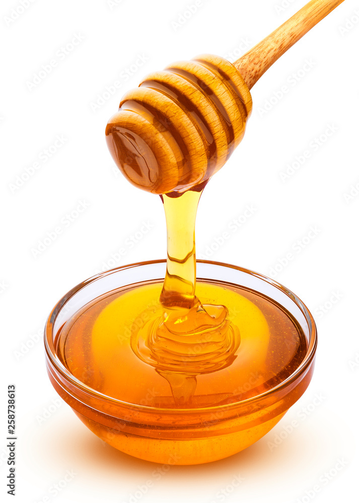 Honey stick and bowl of pouring honey isolated on white background with clipping path Honey stick and bowl of pouring honey isolated on white background with clipping path