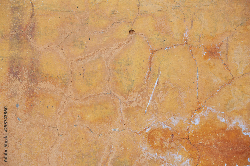 The texture of the old cement wall with scratches, cracks, dust, crevices, roughness, stucco. Can be used as a poster or background for design.