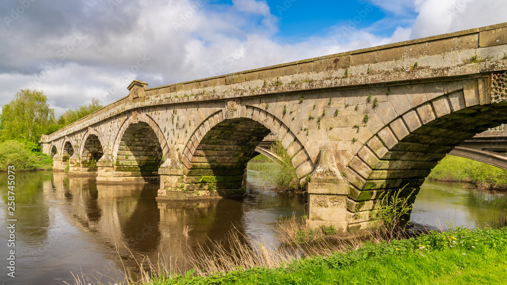 Atcham Old Bridge over the River Severn in Atcham, near Shrewsbury, Shropshire, England, UK