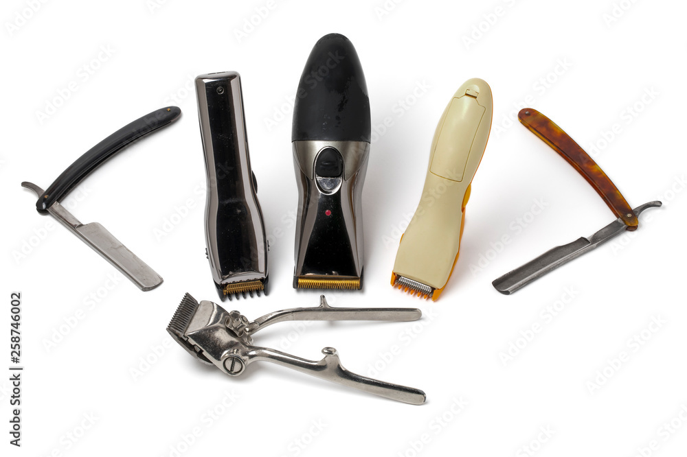 Vintage straight razor, old manual hair clipper and electric hair clippers  isolated on white background. Barbershop tools Stock Photo | Adobe Stock