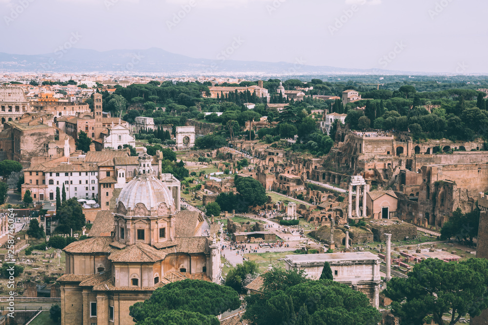 Panoramic view of city Rome with Roman forum and Colosseum from Vittoriano