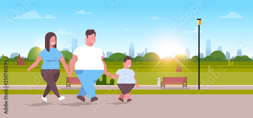 Over size family walking together urban park