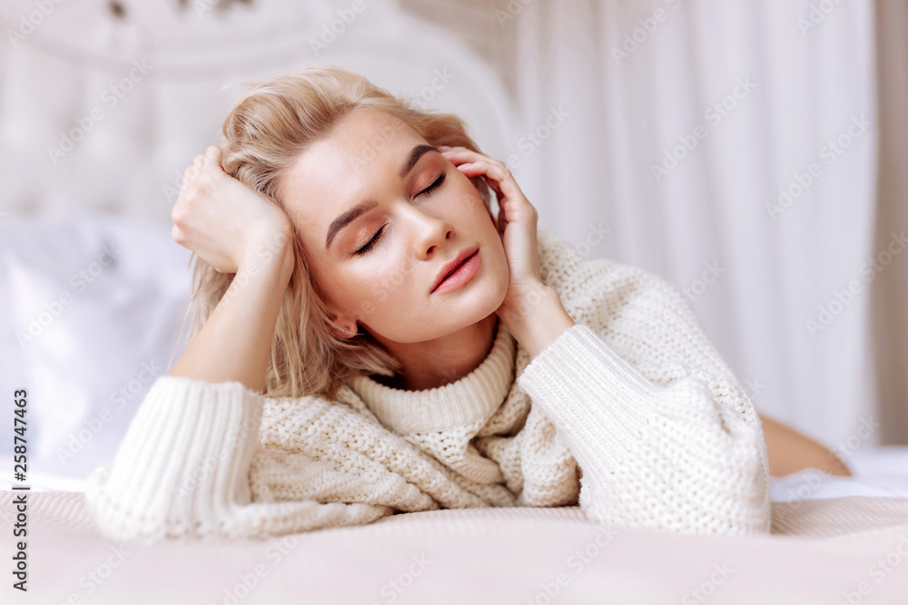 Blonde woman with short hair cut closing eyes feeling satisfied Blonde woman with short hair cut closing eyes feeling satisfied