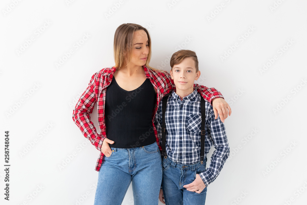 Mothers day, children and family concept - Beautiful woman and her son on white background Mothers day, children and family concept - Beautiful woman and her son on white background