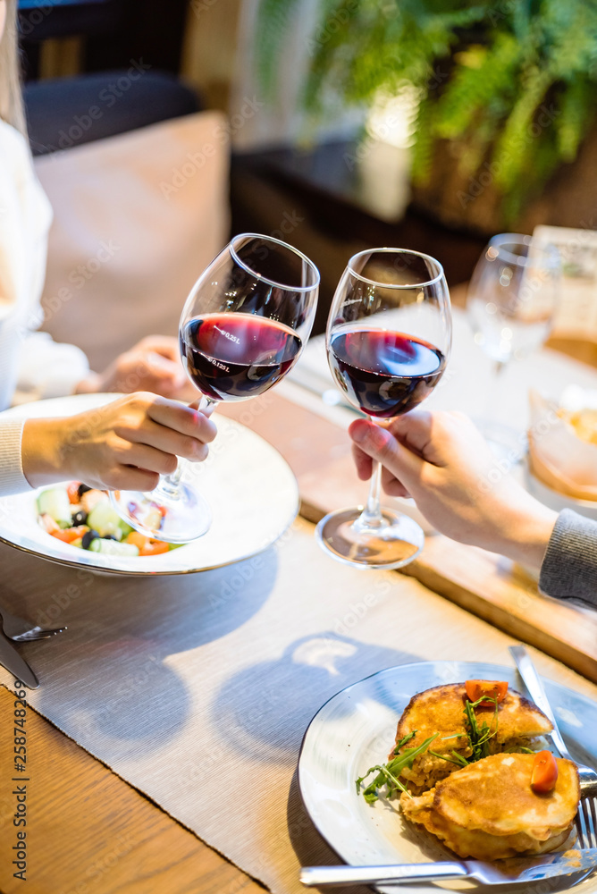 Man and woman drinking red wine in the restaurant