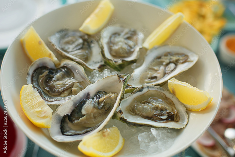 fresh oysters on ice with lemon