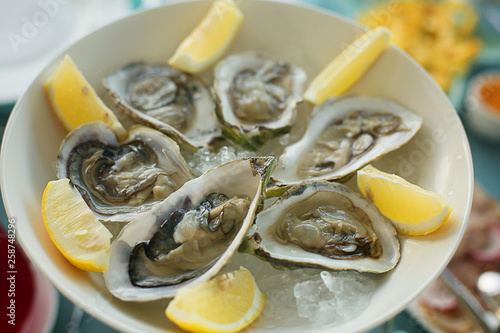 fresh oysters on ice with lemon