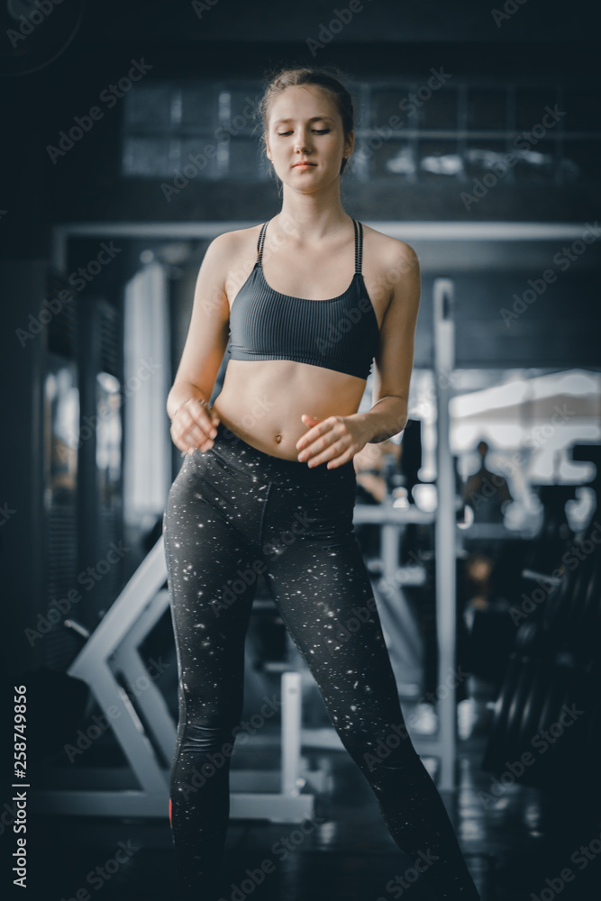 Foto de Portrait young attractive healthy woman body curve fitness doing  exercises workout with ball in gym. People beauty perfect body slim fitness  girl. Freedom happy and relax lifestyle healthcare concept. do