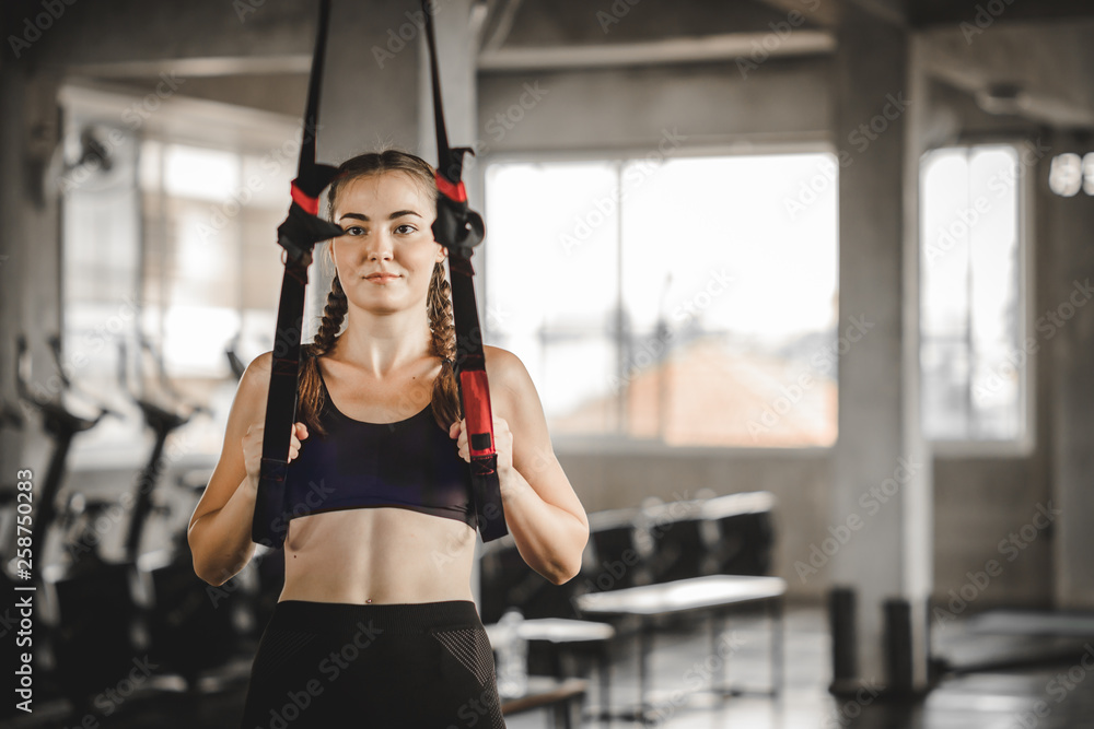 Portrait young attractive healthy woman body curve fitness doing exercises workout with ball in gym. People beauty perfect body slim fitness girl. Freedom happy and relax lifestyle healthcare concept.