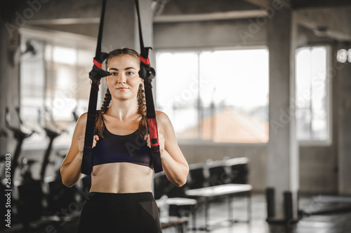 Portrait young attractive healthy woman body curve fitness doing exercises workout with ball in gym. People beauty perfect body slim fitness girl. Freedom happy and relax lifestyle healthcare concept. © Shutter B
