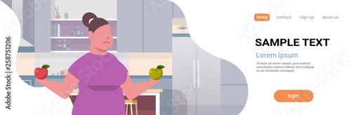 fat obese woman holding apples overweight girl eating fruits obesity weight loss diet concept healthy nutrition modern kitchen interior portrait horizontal copy space