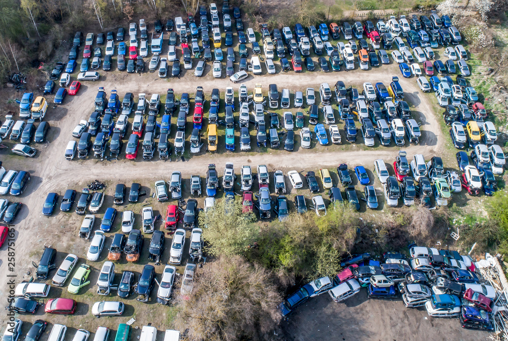 Φωτογραφία Lines of crushed cars wreck in scrapyard before being shredded recyling