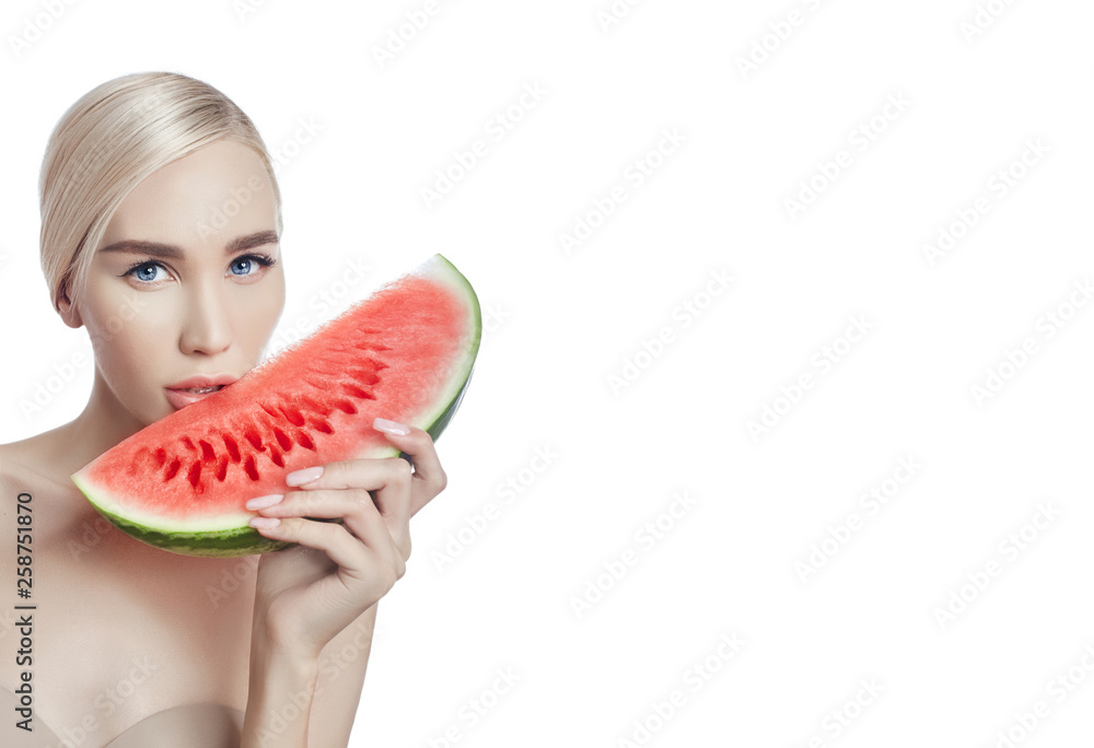 Watermelon in hands of women, clean smooth skin of body and face. Blonde  girl in summer holding a watermelon in hands of face. Anti-wrinkle and anti-aging  skin treatment, natural anti-aging cosmetics Stock