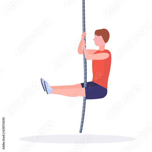 sporty man doing rope climbing exercise guy training in gym cardio crossfit workout healthy lifestyle concept flat white background full length