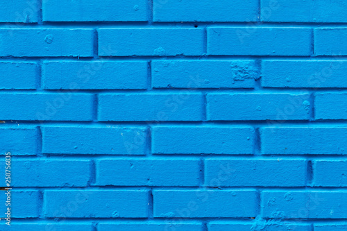 Texture a wall from new bricks of blue color. Ranks are located horizontally