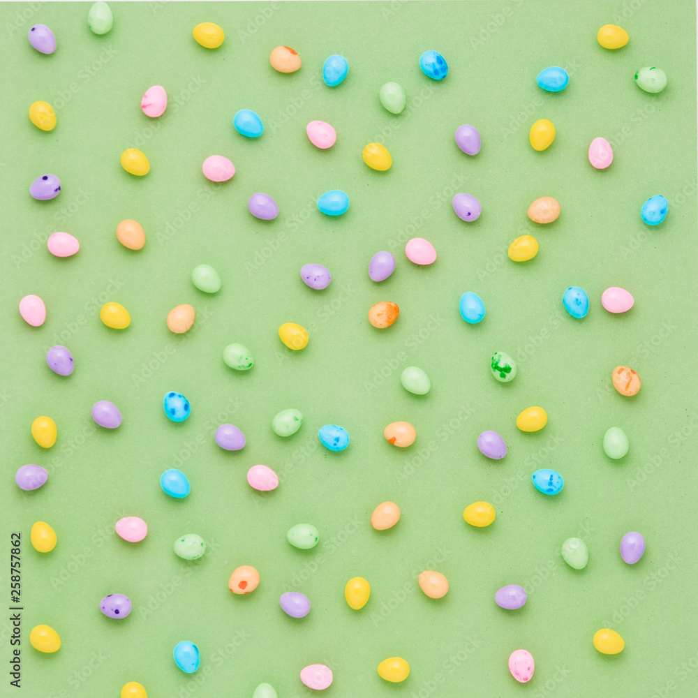 Colorful candy Easter eggs on a green background Colorful candy Easter eggs on a green background