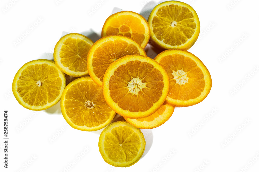 Sliced orange slices, stacked isolated on a white background Sliced orange slices, stacked isolated on a white background