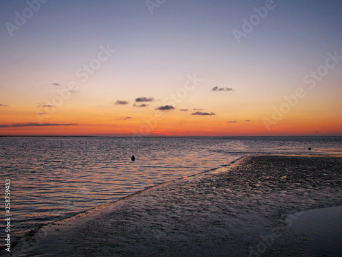 Sunset at low tide. Sea evening.