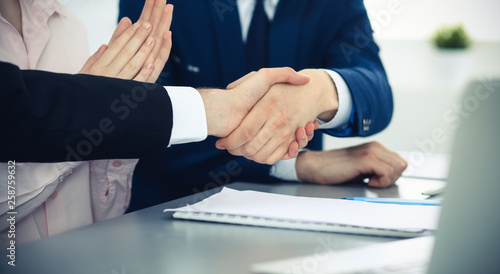 Business people shaking hands finishing up a meeting. Handshake at successful negotiation