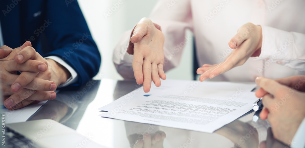 Group of business people and lawyers discussing contract papers. Success at meeting or negotiation - obrazy, fototapety, plakaty 
