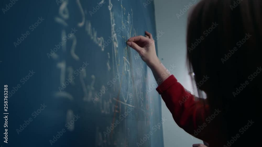 Students write on the Board of mathematical formulas, talk, discuss. Students write in chalk on the wall, draw graphs. Teenagers are preparing for the exam. Hands close up. Slow motion, 4K Students write on the Board of mathematical formulas, talk, discuss. Students write in chalk on the wall, draw graphs. Teenagers are preparing for the exam. Hands close up. Slow motion, 4K