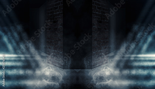 Background of empty dark room with brick walls, illuminated by neon lights with laser beams, smoke