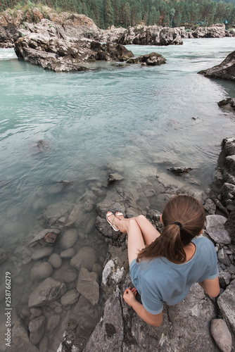 Woman resting at river in A...