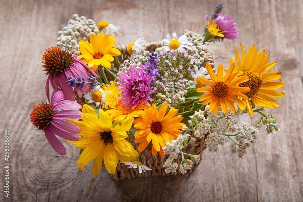 bouquet of field wild flowers in a vase on old boards bouquet of field wild flowers in a vase on old boards