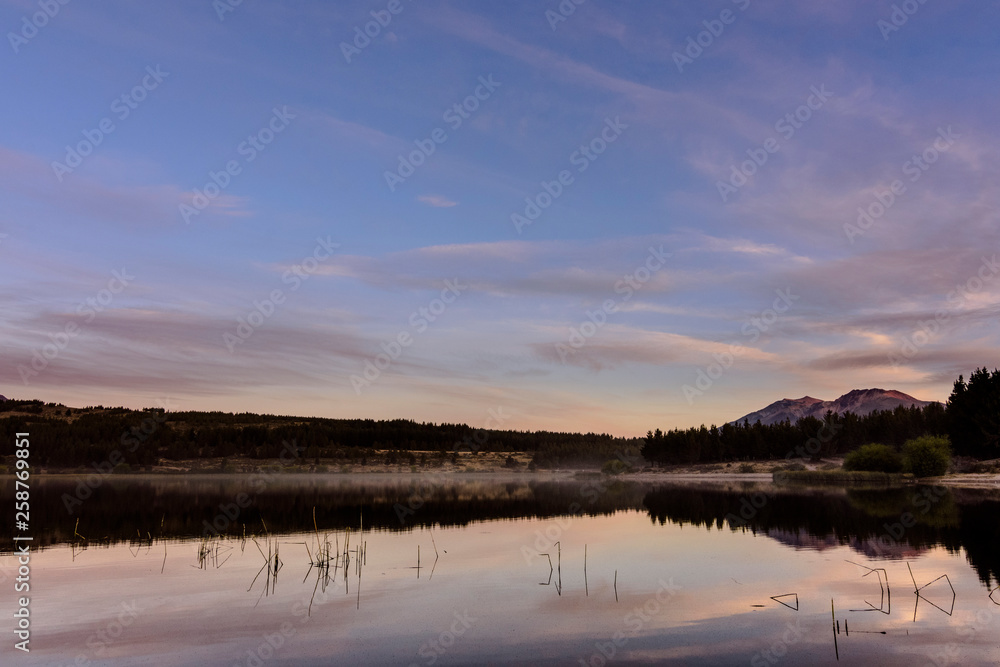 Scene view of a sunset reflected on a lake