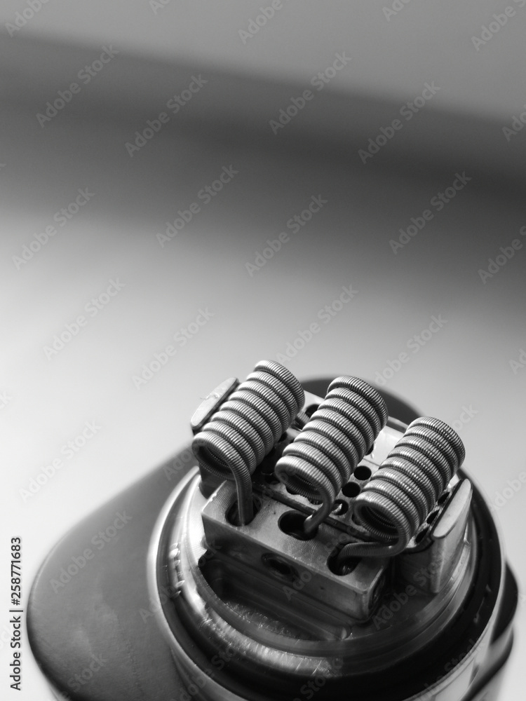 Three coils on rebuildable vape atomizer Three coils on rebuildable vape atomizer