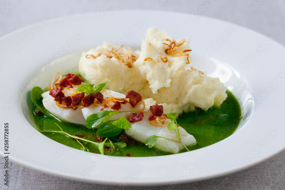 Butter poached cod with green peas, spinach and basil veloute, crispy chorizo and shallot Butter poached cod with green peas, spinach and basil veloute, crispy chorizo and shallot