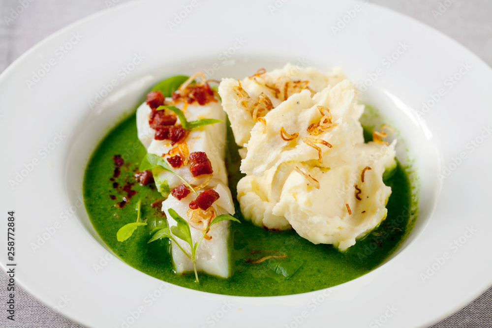 Butter poached cod with green peas, spinach and basil veloute, crispy chorizo and shallot Butter poached cod with green peas, spinach and basil veloute, crispy chorizo and shallot