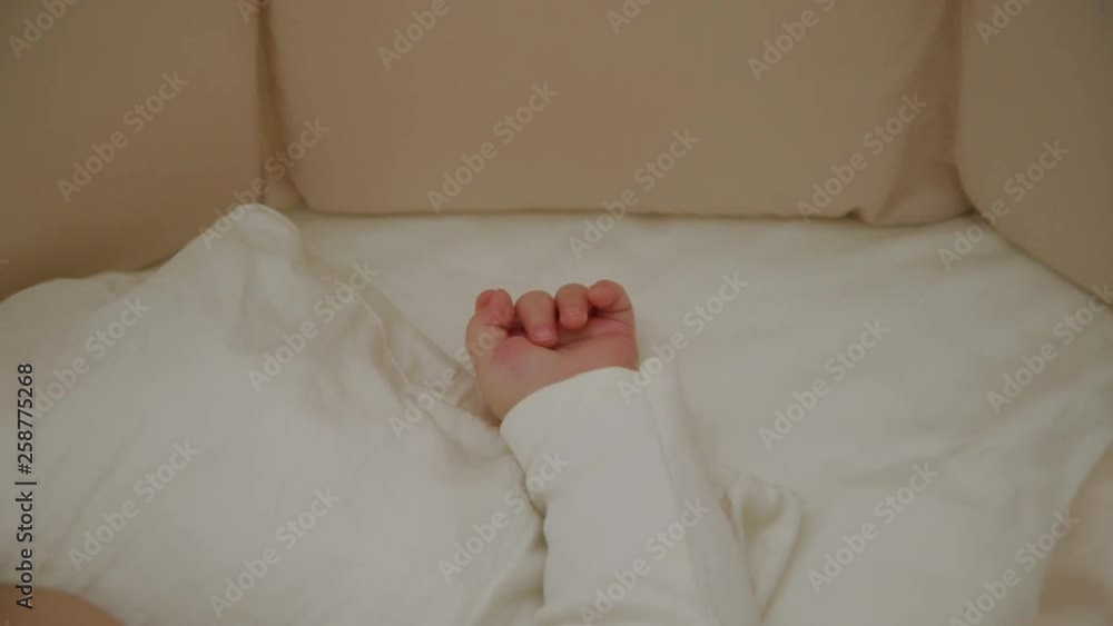 Beautiful little girl sleeping in her cot. Beautiful little girl sleeping in her cot.