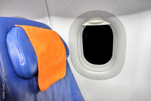 airplane interior seat and window view with black isolated outdoor glass template air travel transportation inside passenger plane cabin side view on aircraft window blue chair headrest design mockup