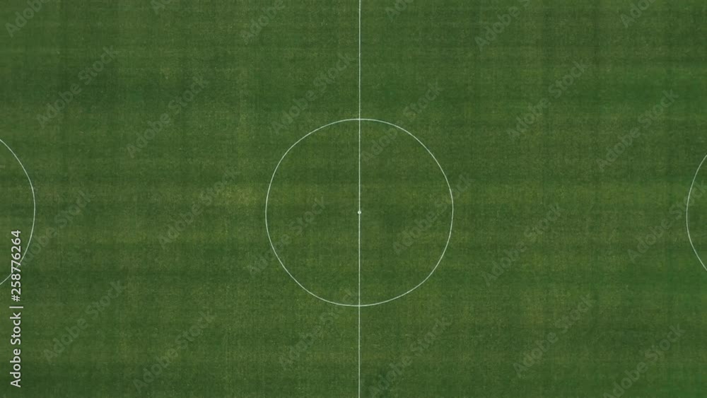Football green field shot from a drone with raising up Football green field shot from a drone with raising up